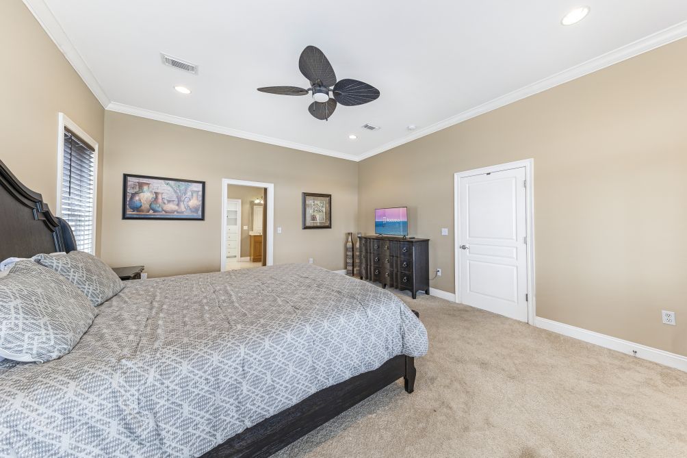 Bedroom with king bed and ceiling fan