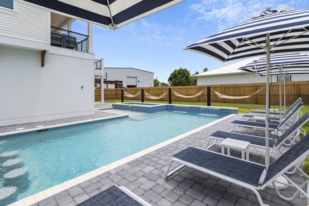 Luxury loungers, matching umbrellas, and hammocks.