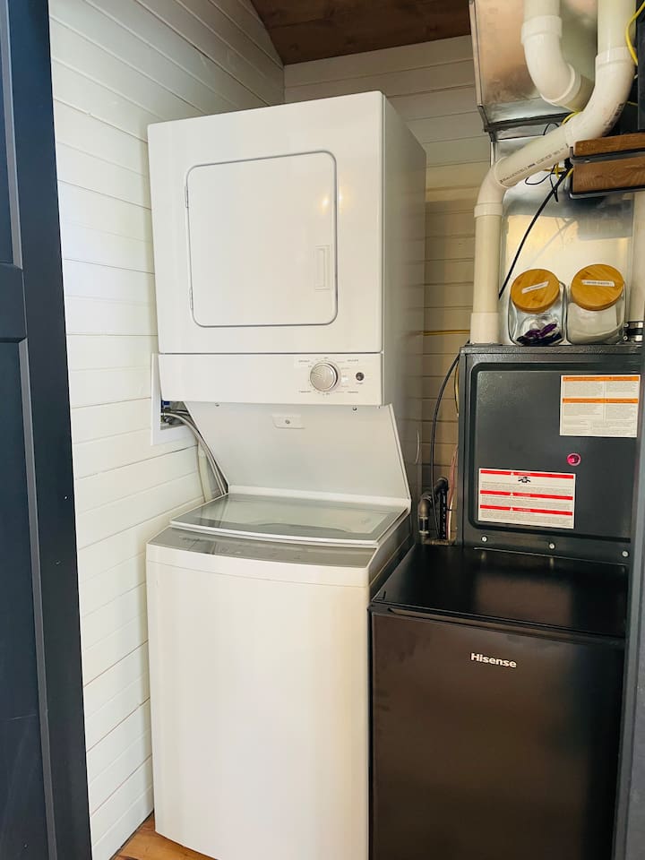 This treehouse has a stacked washer and dryer available for guests to use. 