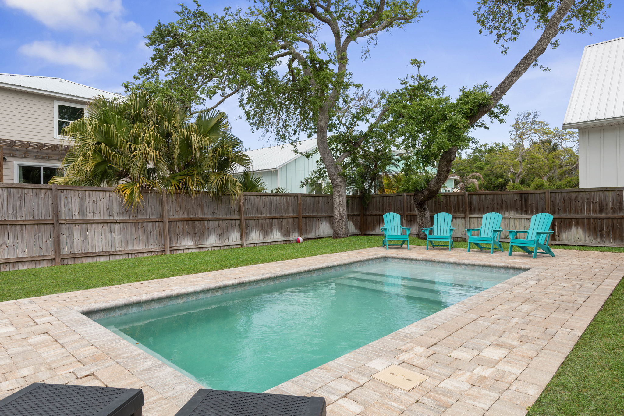 Relax poolside in your private fenced backyard oasis.