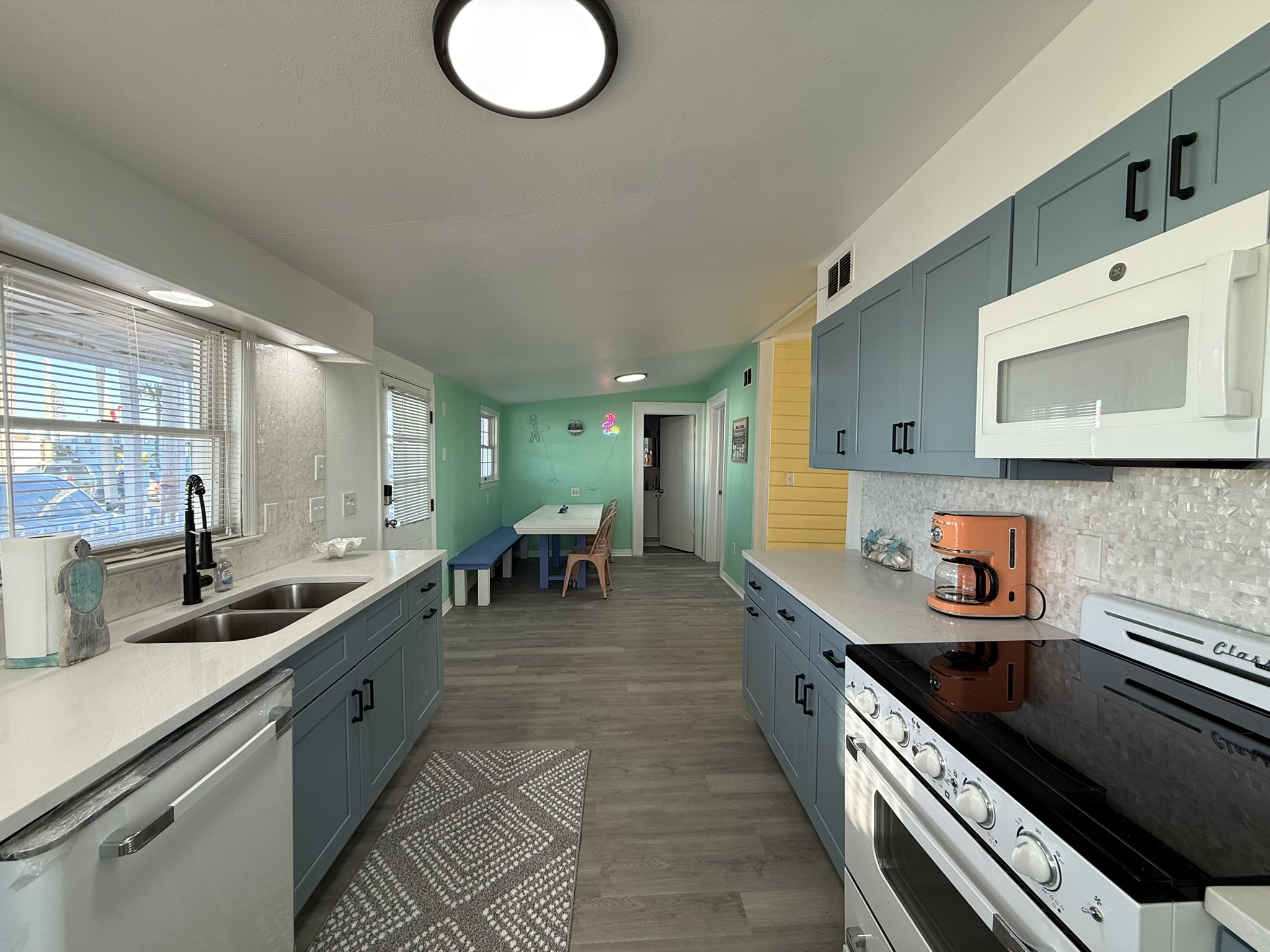 Blue Kitchen Cabinets with Retro Appliances and Mother of Pearl Backsplash!