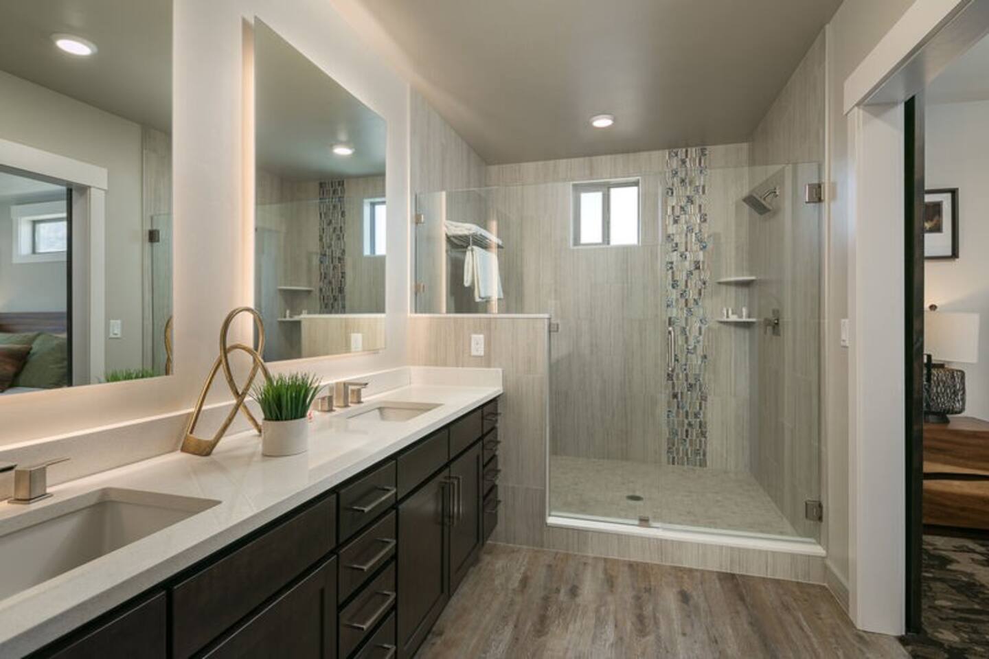 The beautiful master bath features a spacious walk-in shower with luxurious touches.