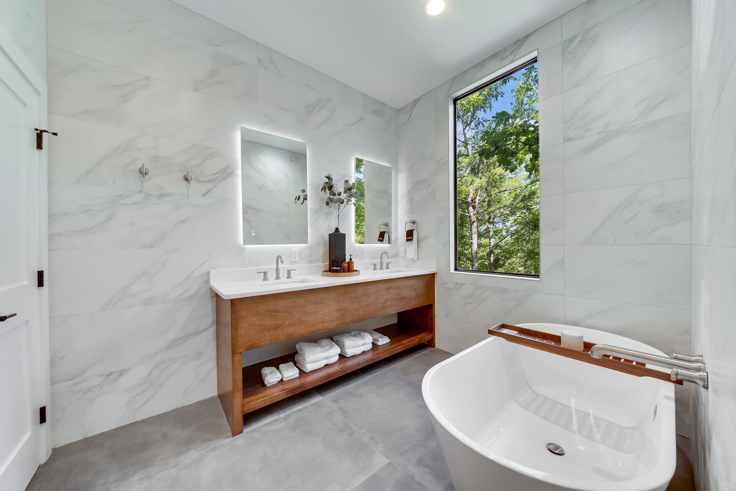Ensuite Bathroom 2 - Attached to King Suite 2. Featuring oversized rain shower with dual showerheads, soaking tub and spa-quality marble finishes. Includes premium toiletries (body wash, shampoo, conditioner, hand soap) and hotel quality towels.