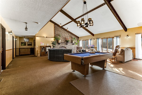 The Great Room has plenty of seating areas and a pool & game table for your enjoyment.