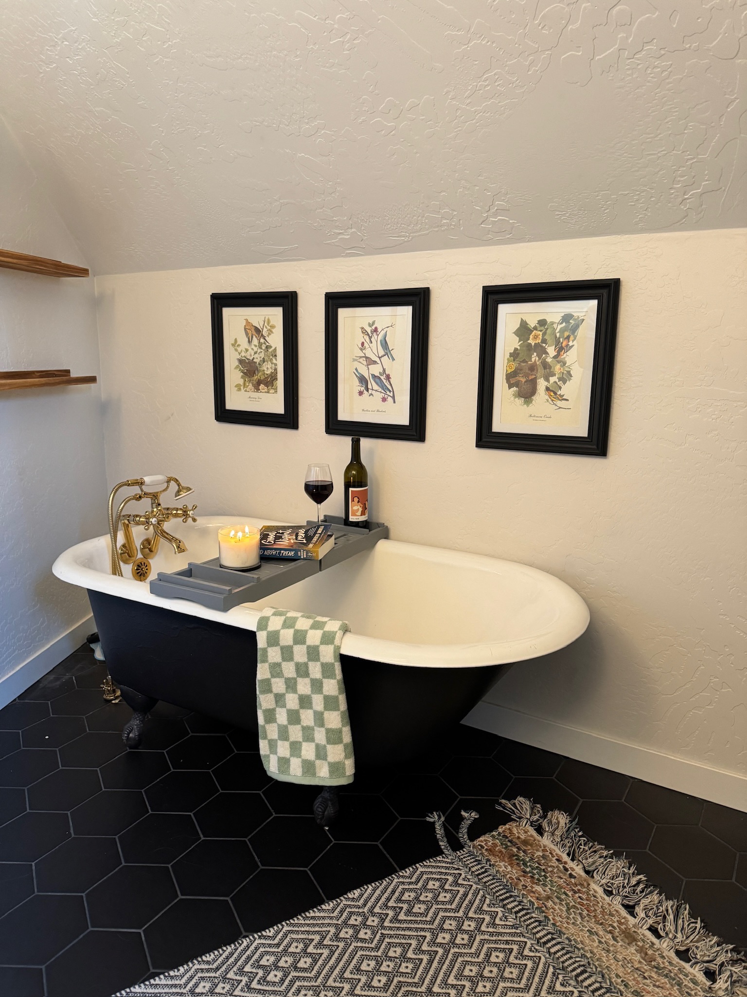 This primary bathroom features a clawfoot soaking tub and shower for a relaxing bathing experience.
