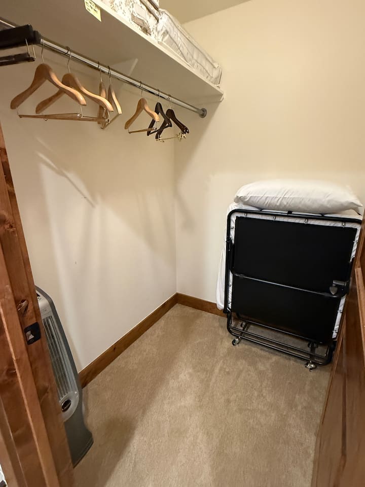 Roll away bed is stored in the attached walk in closet but will be set up in the bedroom for reservations with 10 guests. 