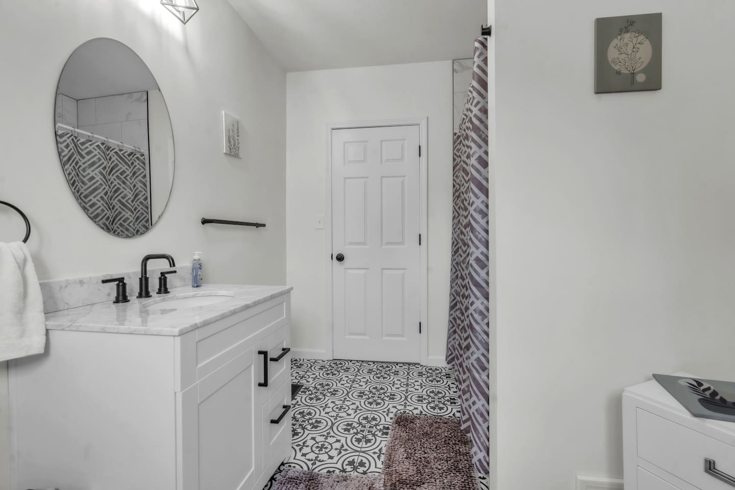 Full bathroom with a relaxing bathtub, perfect for unwinding and enjoying a soothing soak.