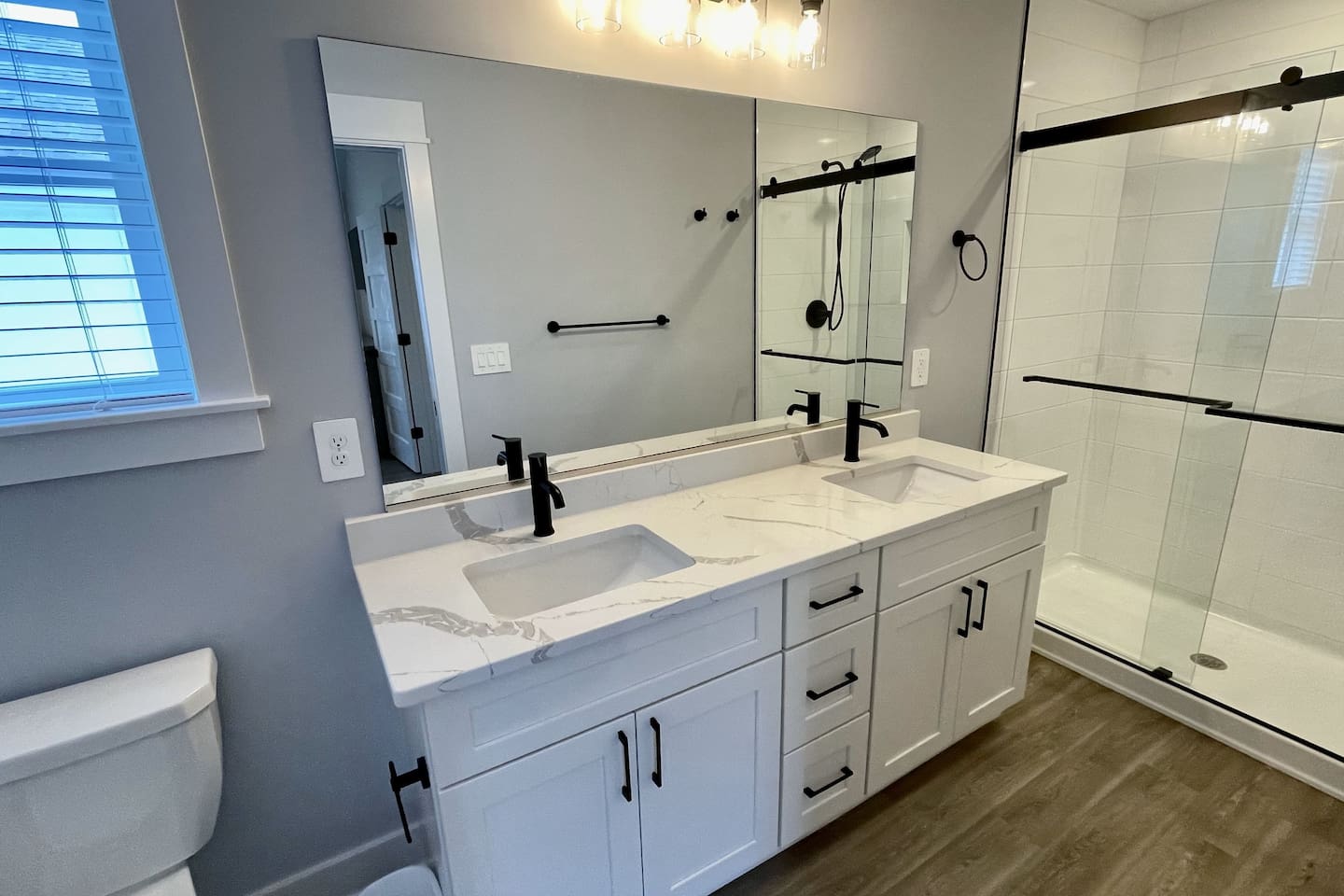 Bright and spacious ensuite with modern finishes and plenty of room to unwind