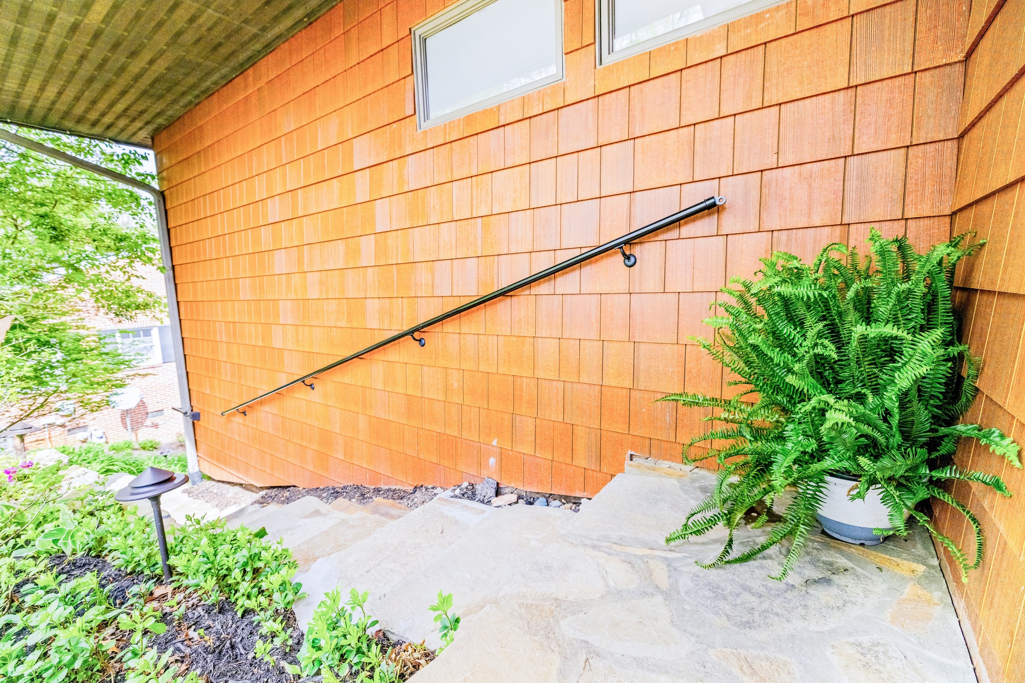 More than one way to reach the Koi pond level and to 'move in'. Turn left off the front stairs and follow to the lower level entry!