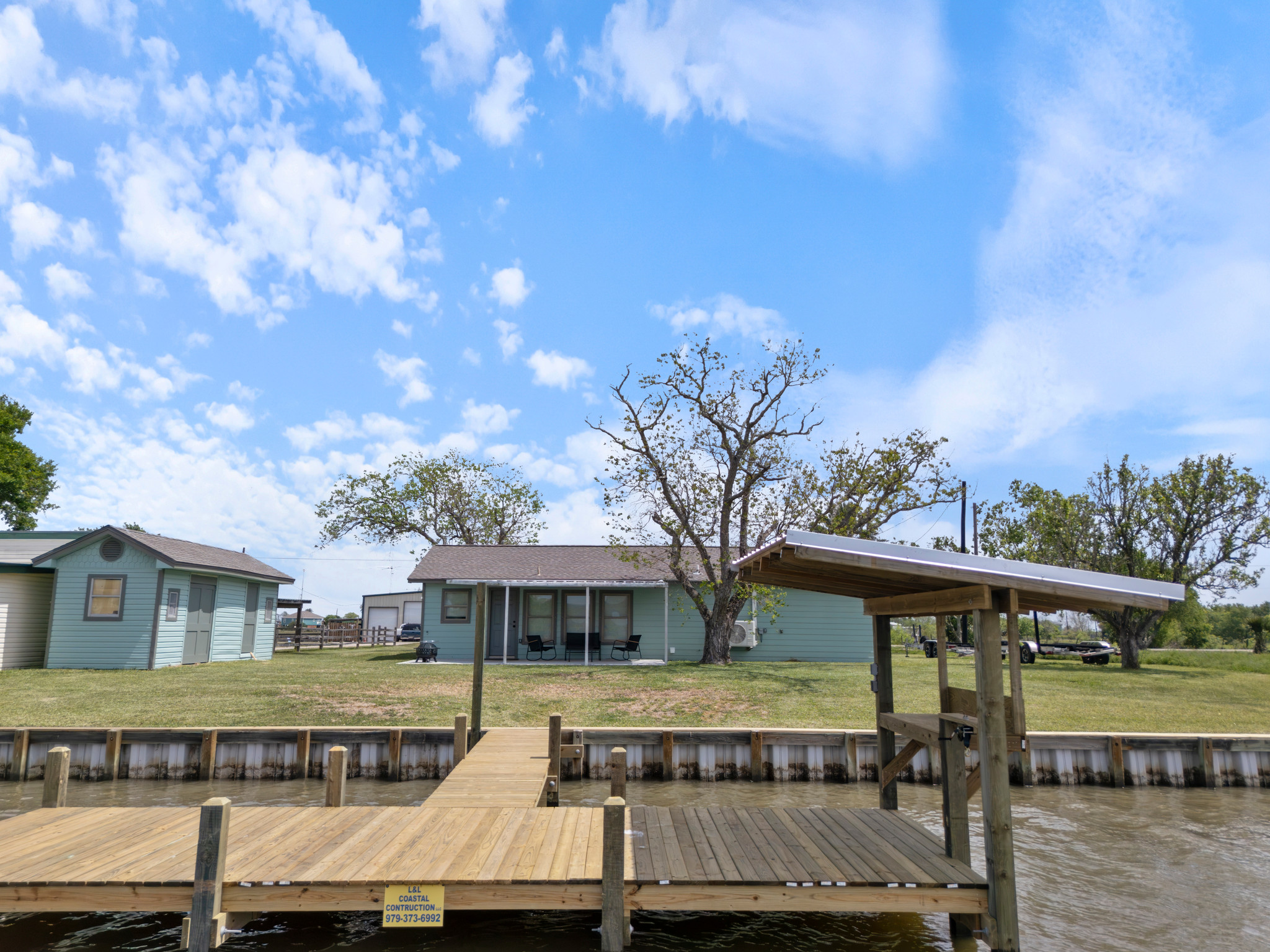 View of pier and backyard from the creek.