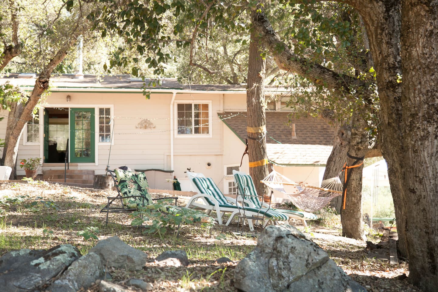 Main house front patio with comfy lounge chairs