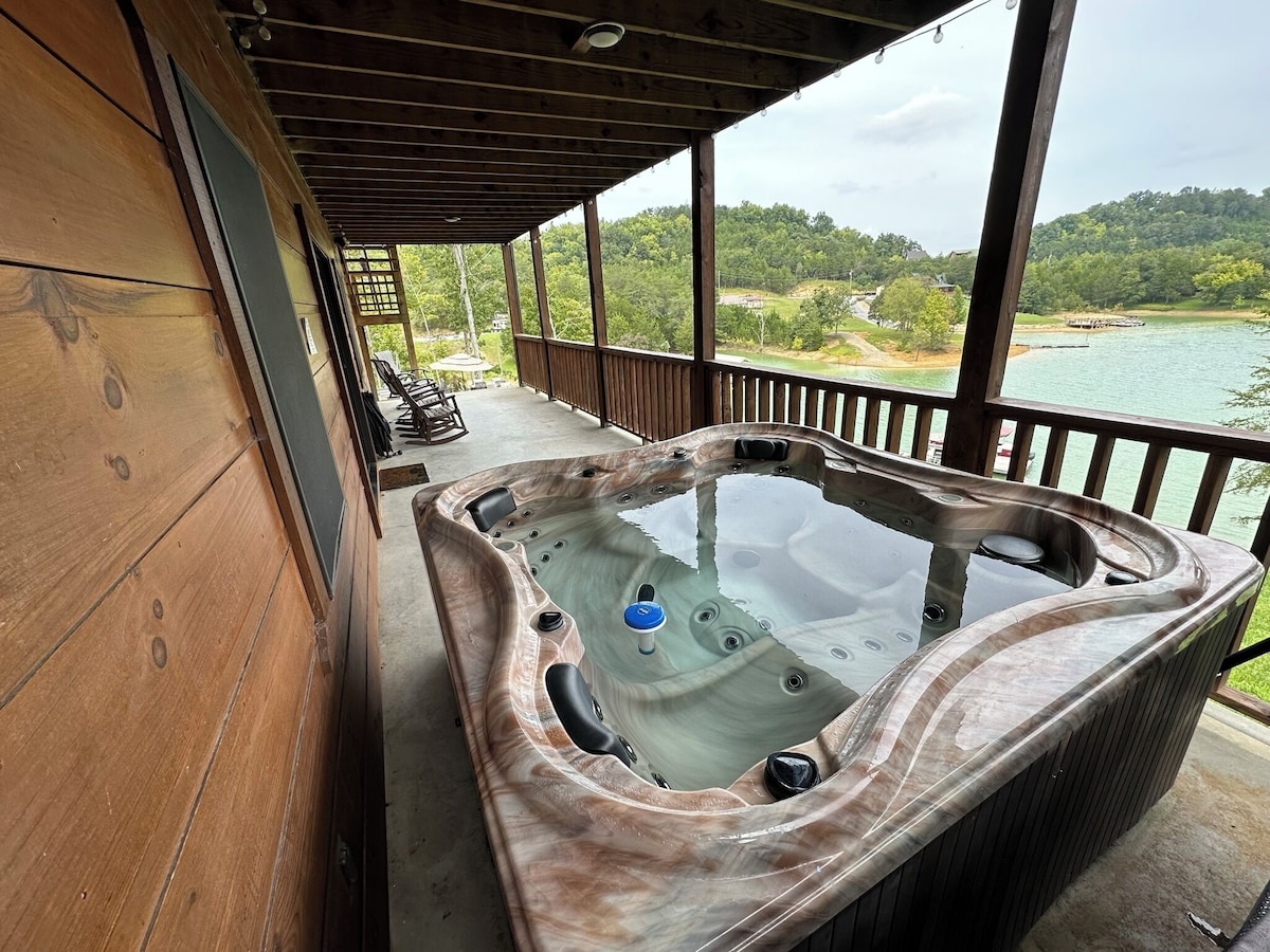 Enjoy the large heated hot tub during the day and under patio lights at night on the large back porch overseeing Douglas Lake while other folks in your group enjoy the view relaxing on the high quality rocking chairs. 