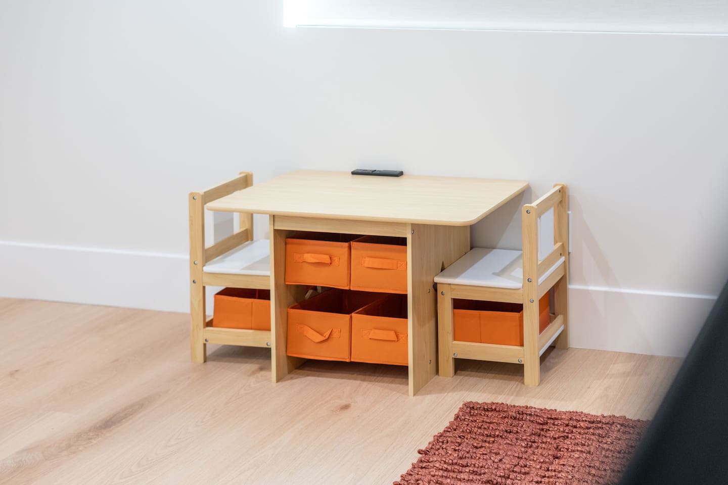 Child-sized play table with bins—ideal for games, coloring, and crafts.