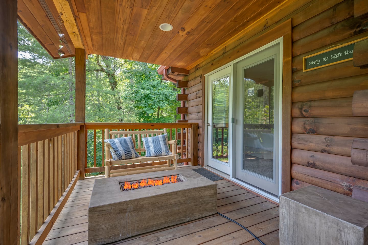 Main level deck overlooking the river with firepit