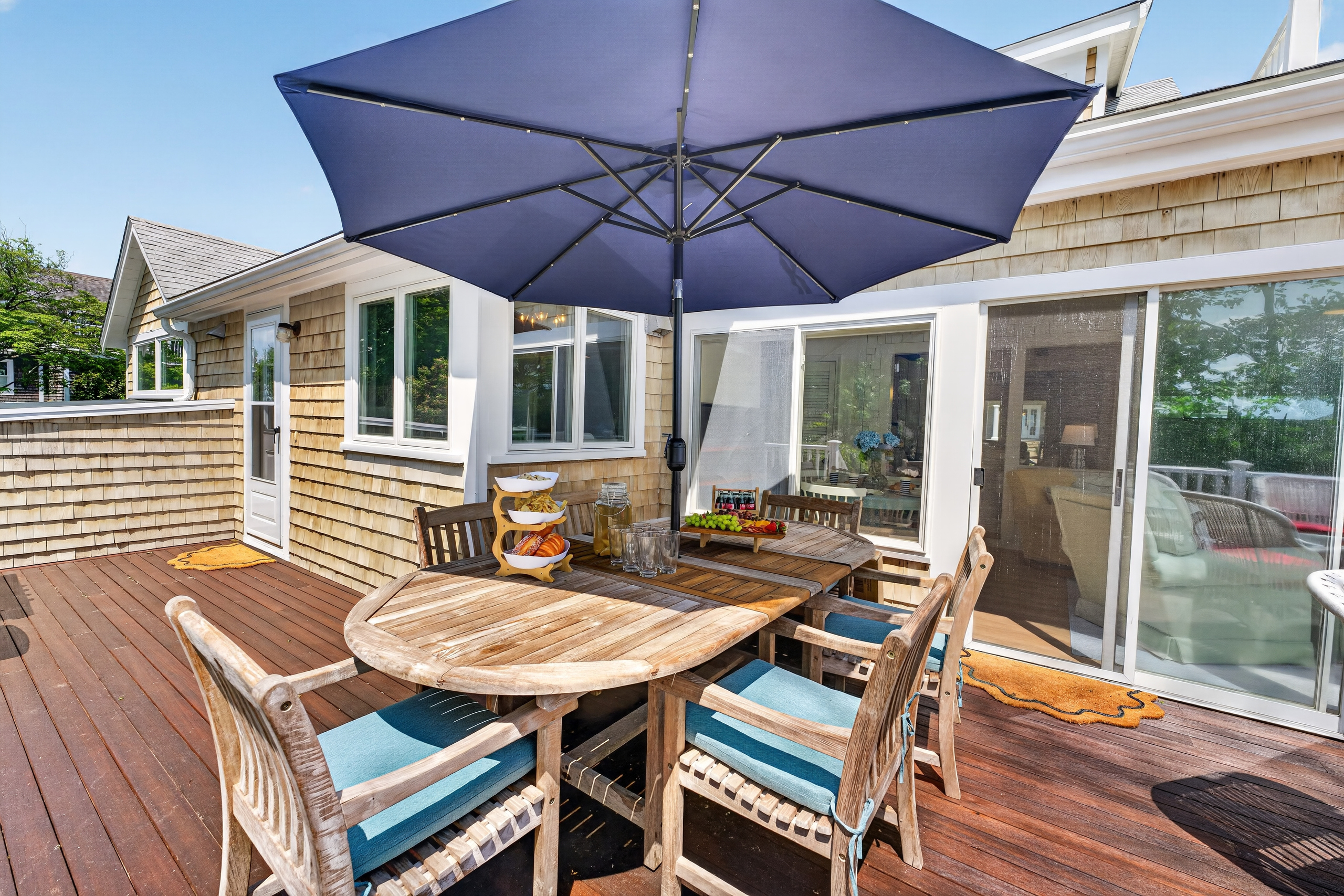 Comfortable outdoor furniture provides the perfect spot to relax and enjoy the fresh coastal air.