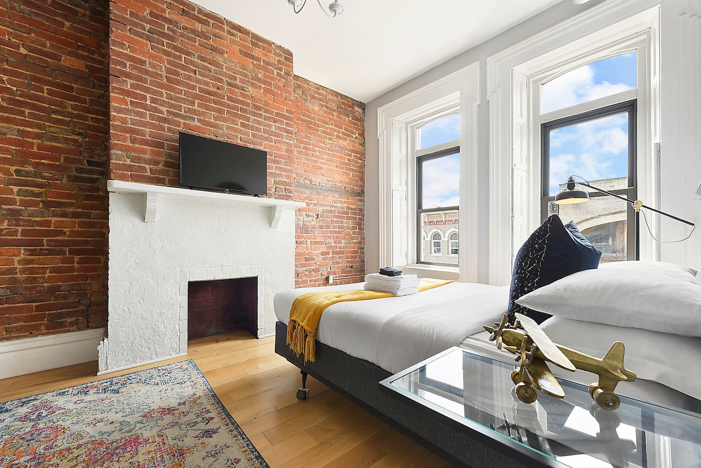 Spacious and elegant queen-sized bedroom with TV designed for comfort and style.