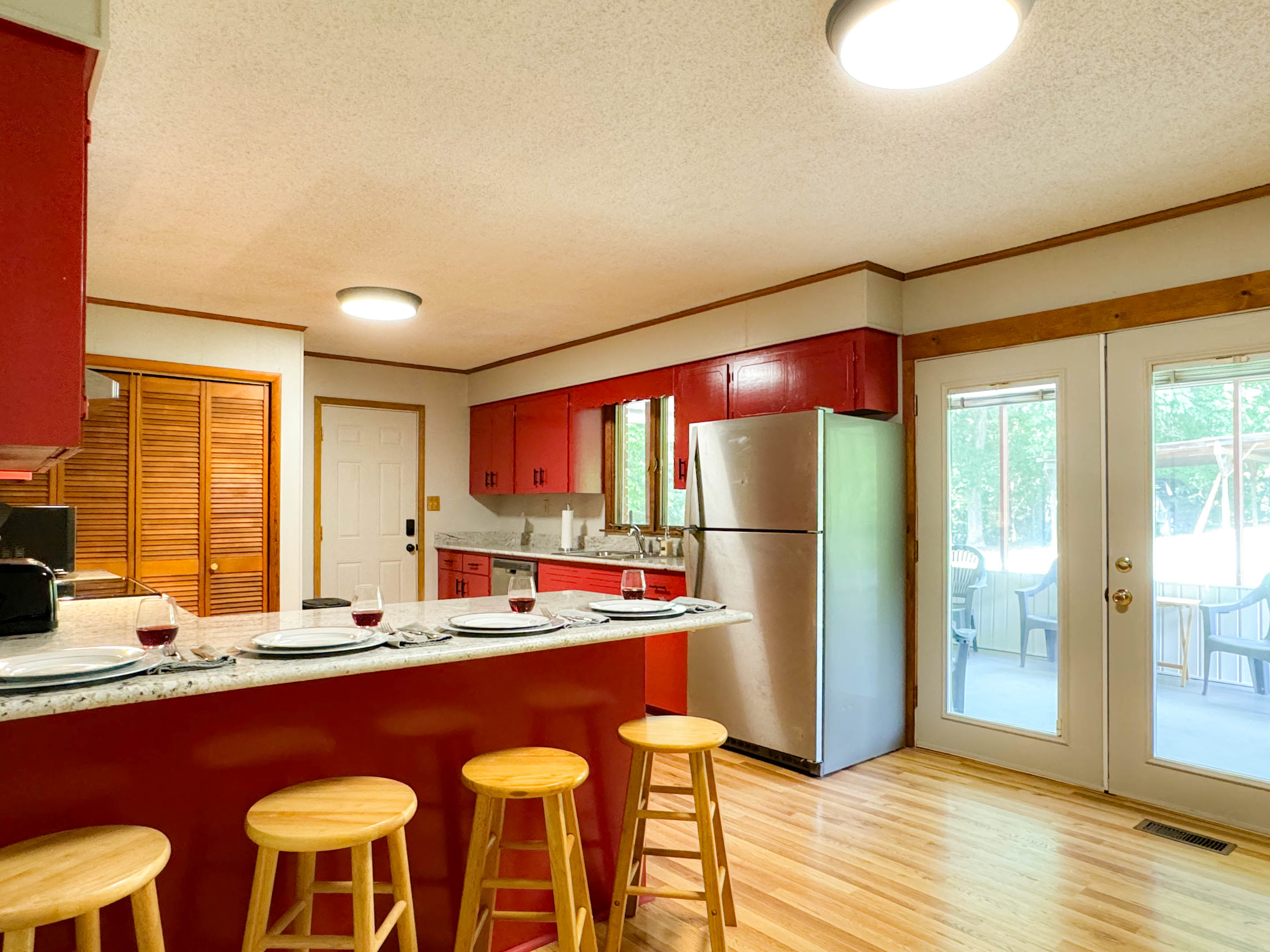 The kitchen has granite countertops with 4 top bar seating and a small dining table for up to 4 as well.