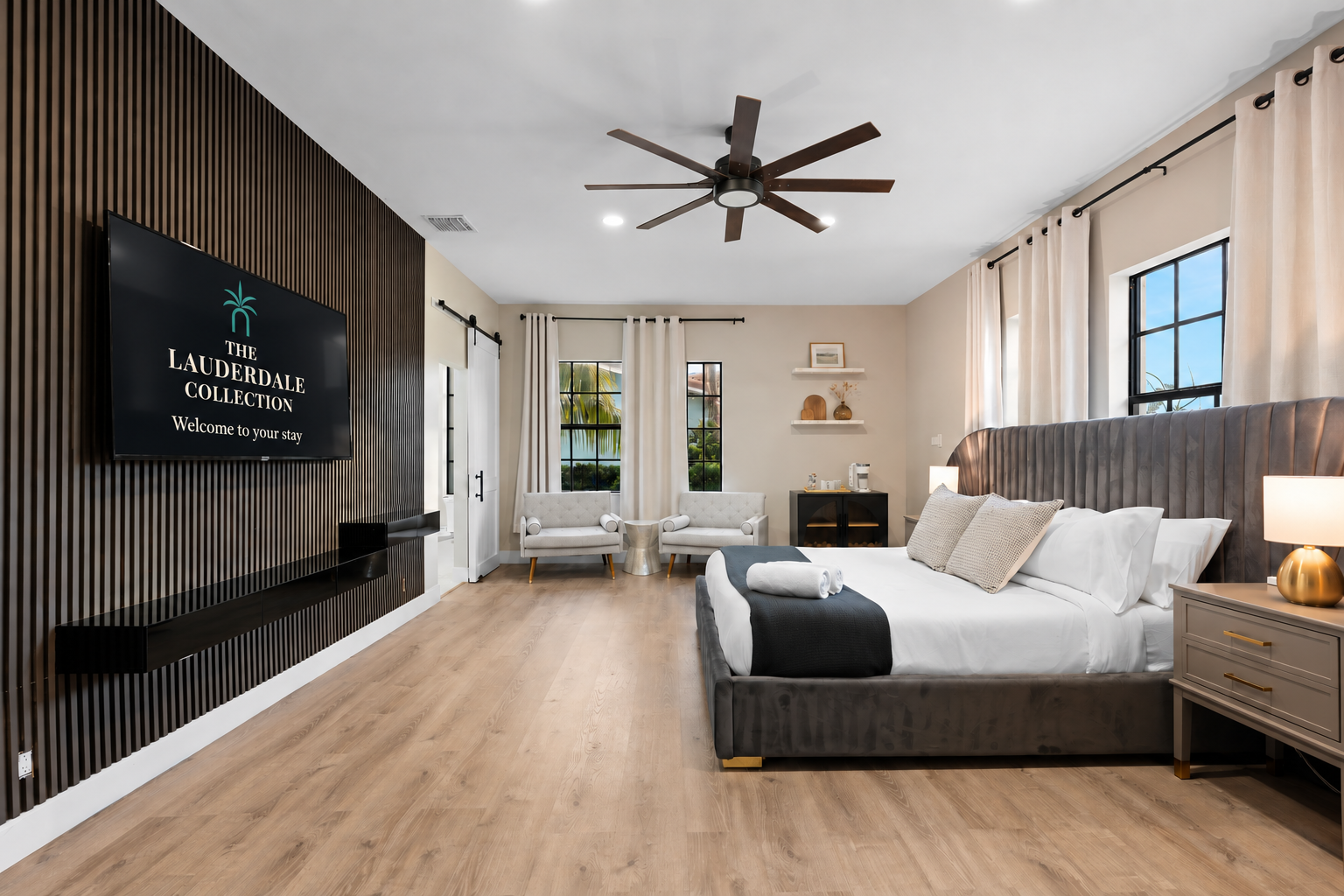 🛌 Downstairs master suite with 65" TV, cozy chairs, and your own coffee station to start off each day.