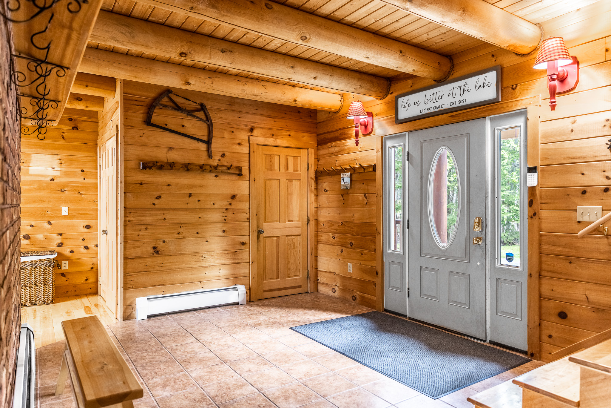 Chalet has huge logs and windows overlooking the lake giving it the true feel of lakefront retreat. 1/2 bath by main entrance in addition to 5 full bathrooms.