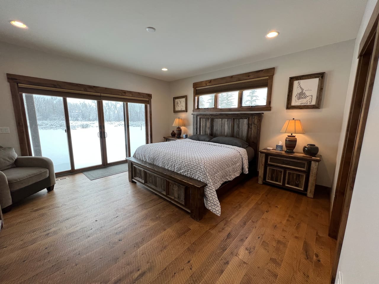 main floor master with king bed and attached bathroom