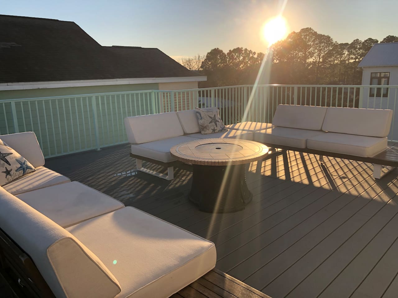 Unwind on the luxury upstairs deck with plush outdoor couches.  Perfect for stunning sunsets!  Enjoy an immersive movie night under the stars with our outdoor projector. The ultimate Blue Mountain Beach retreat!