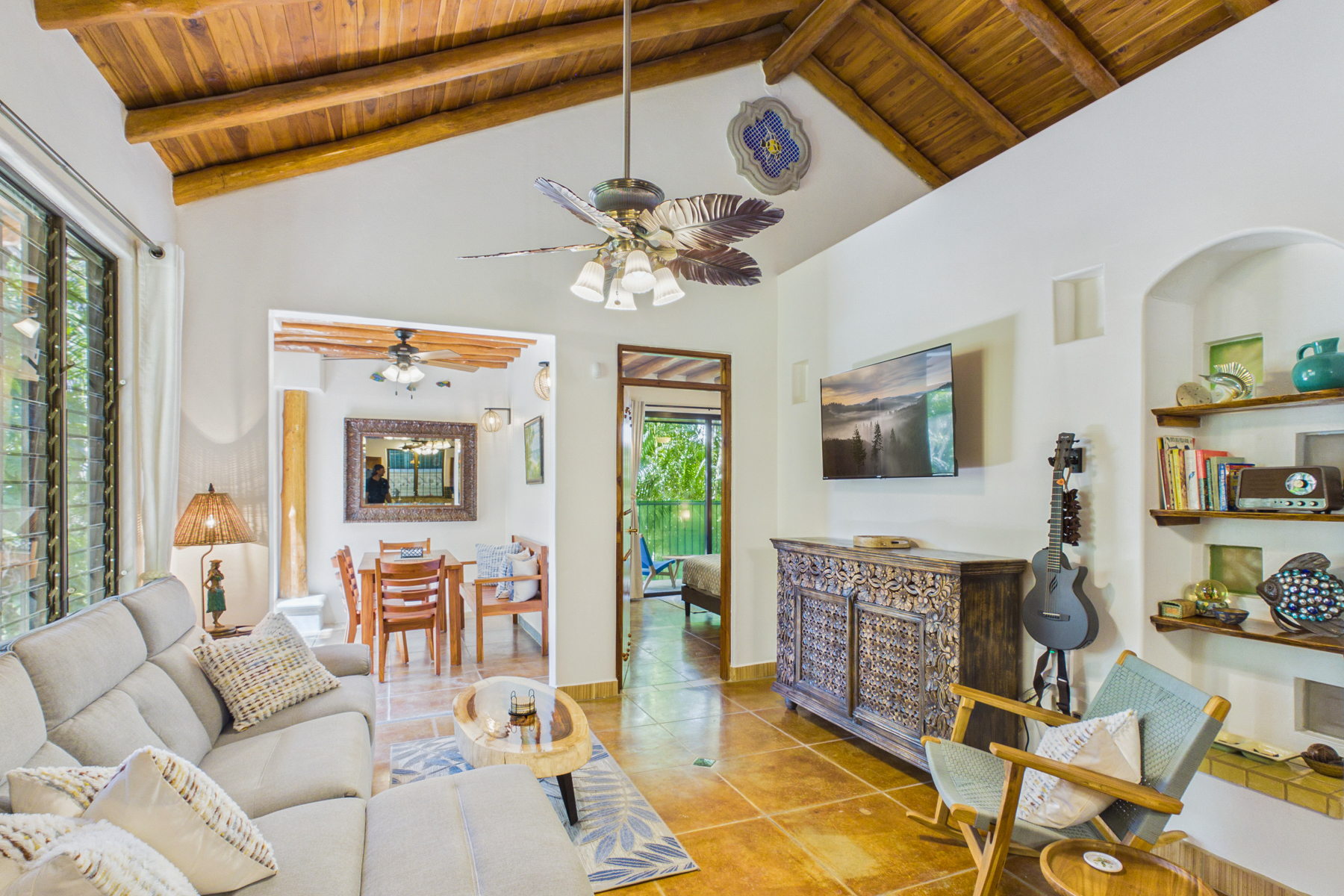 Living room and Indoor dining room.  Entry into bedroom 1