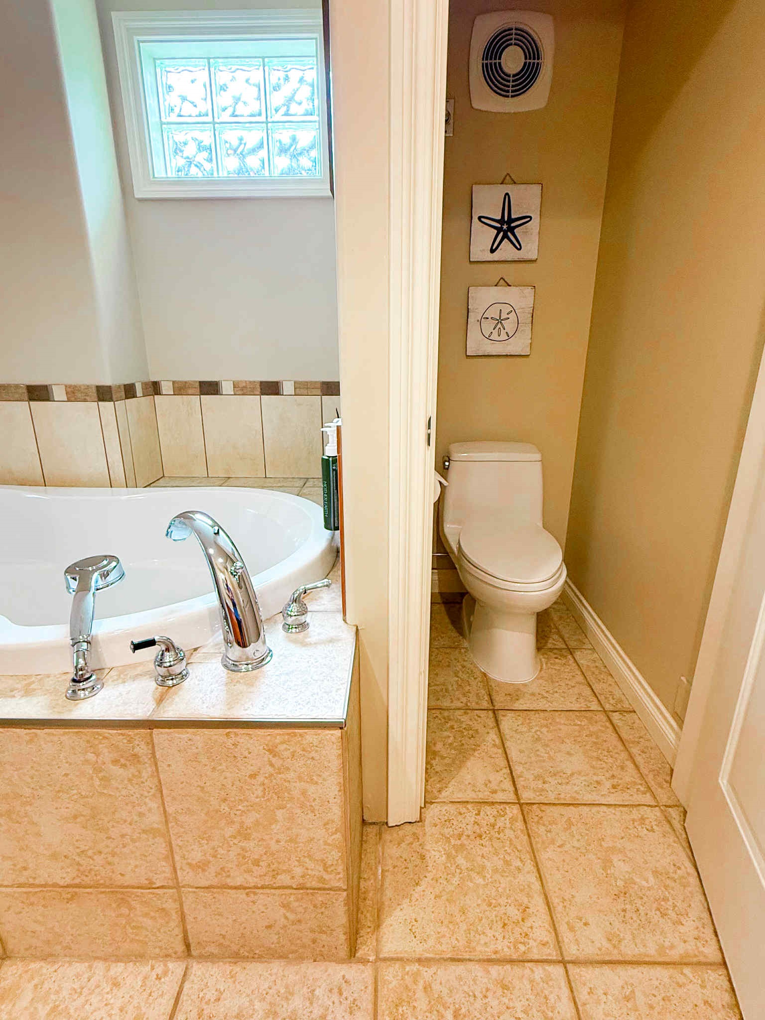 Unit A Soaker tub and private toilet in Primary bedroom.