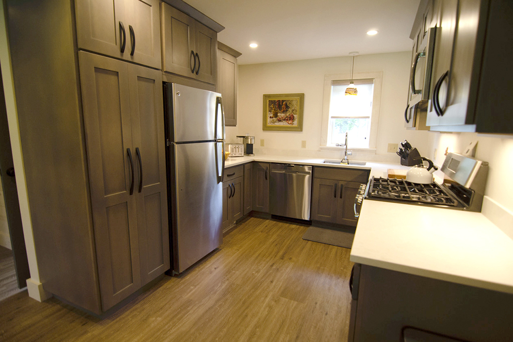 Countertop - Toaster, Blender, K-cup coffee maker. Lots of cabinet space outfitted with everything functional one needs to entertain, cook and dine.