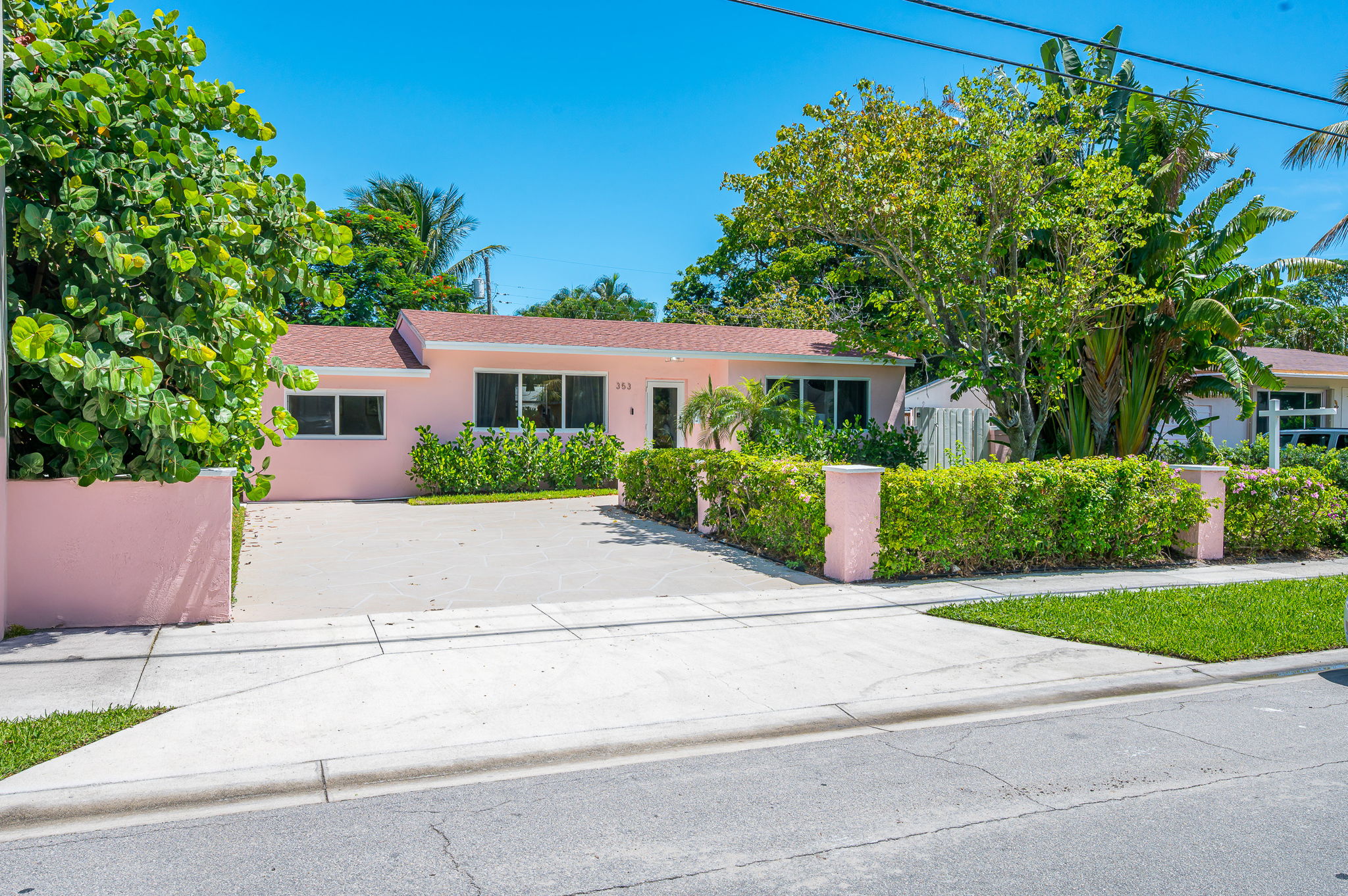 This charming SoSo home welcomes you with its cheerful pink exterior, tropical landscaping, and coastal charm. Located in a safe, walkable neighborhood—just steps from shops, and restaurants.