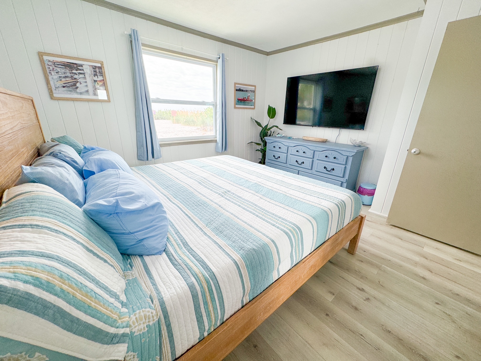 Colorful Primary Bedroom w/65" TV