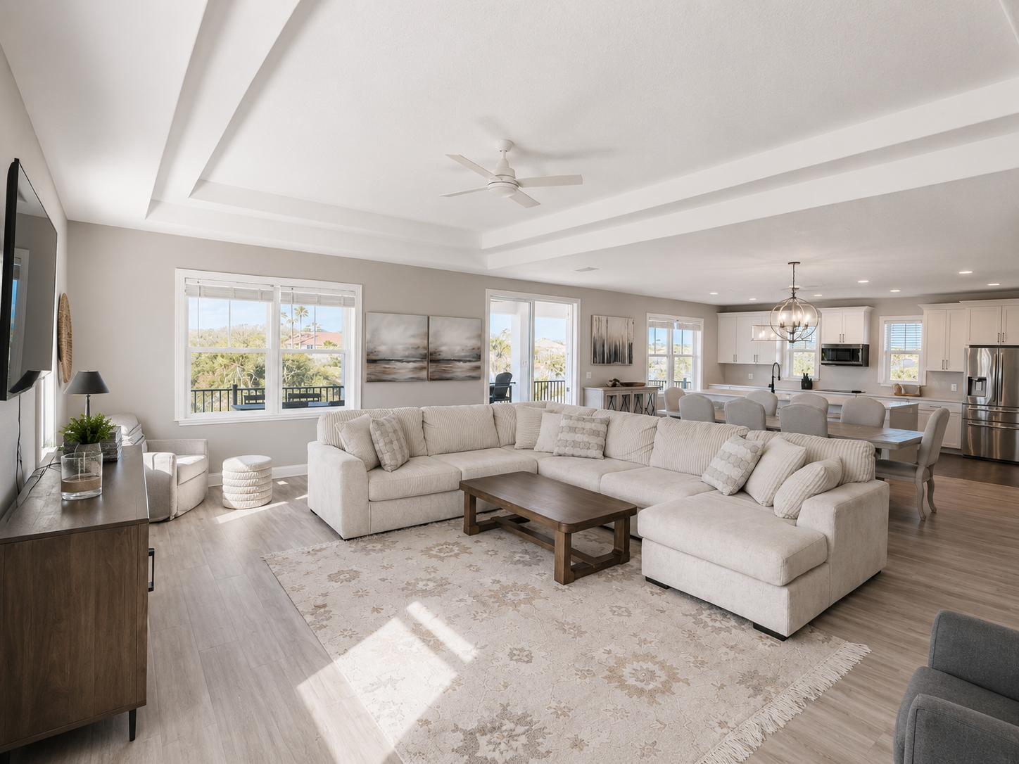 The heart of the home: sink into the oversized sectional as the cook calls out from the kitchen and someone sets the table nearby. Open, sunlit, and made for movie nights and lazy afternoons, this is where the family naturally comes together.