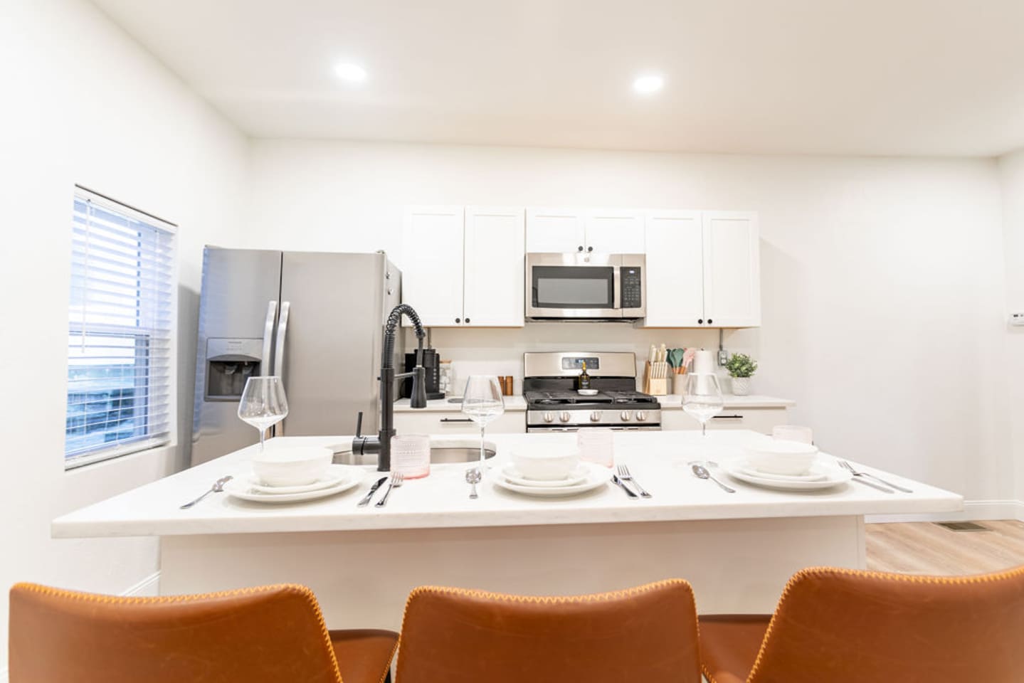 Chic kitchen dining countertop featuring a beautiful set of dishes, perfect for enjoying meals in style.