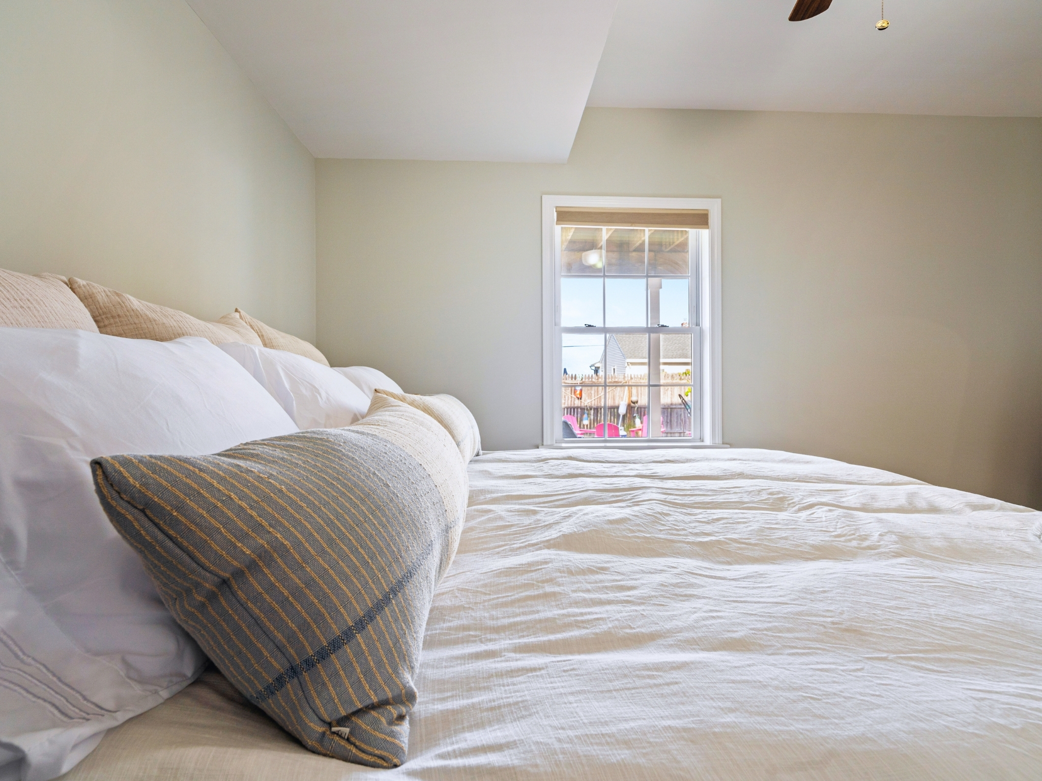 Here’s the second bedroom in our basement, complete with a spacious king bed for ultimate comfort and relaxation
