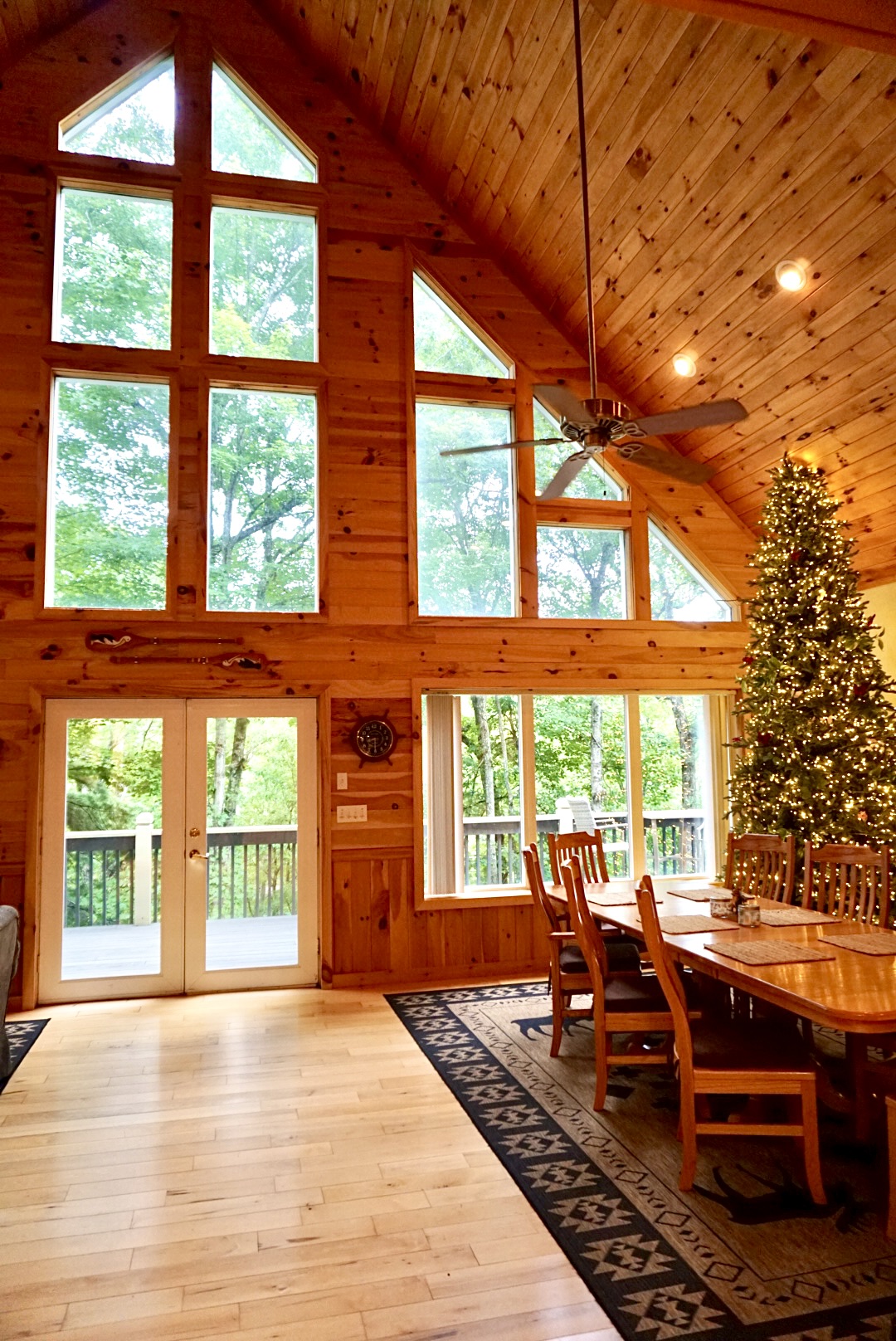 Great Room: Experience serene nature views through grand windows in this stunning wooden retreat!
