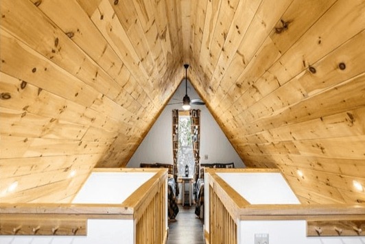 Open loft sleeping area in a Ledge Brook cabin