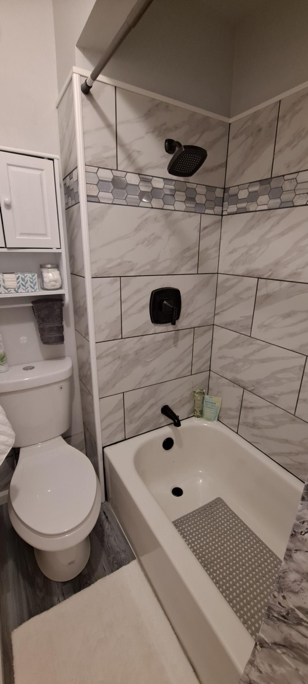 Spa-like bathroom with deluxe amenities and tub