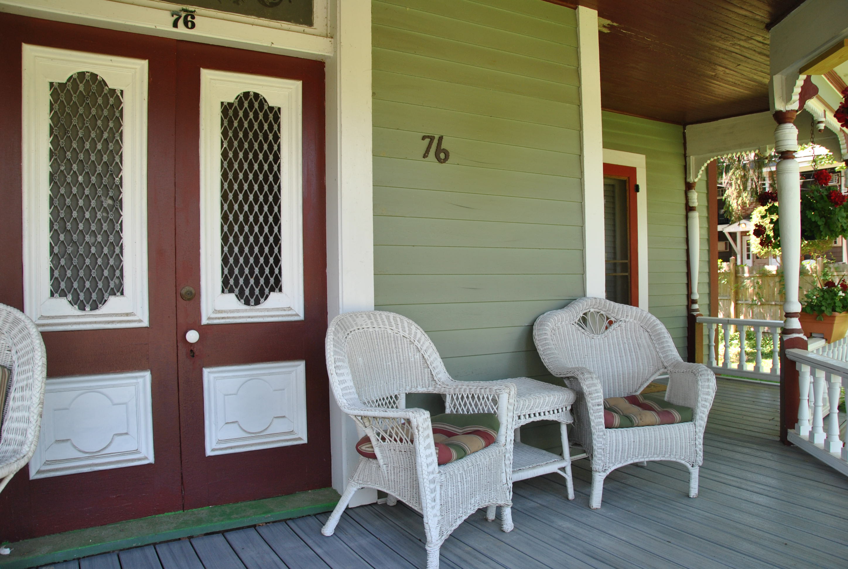 Sitting area on porch for guests.