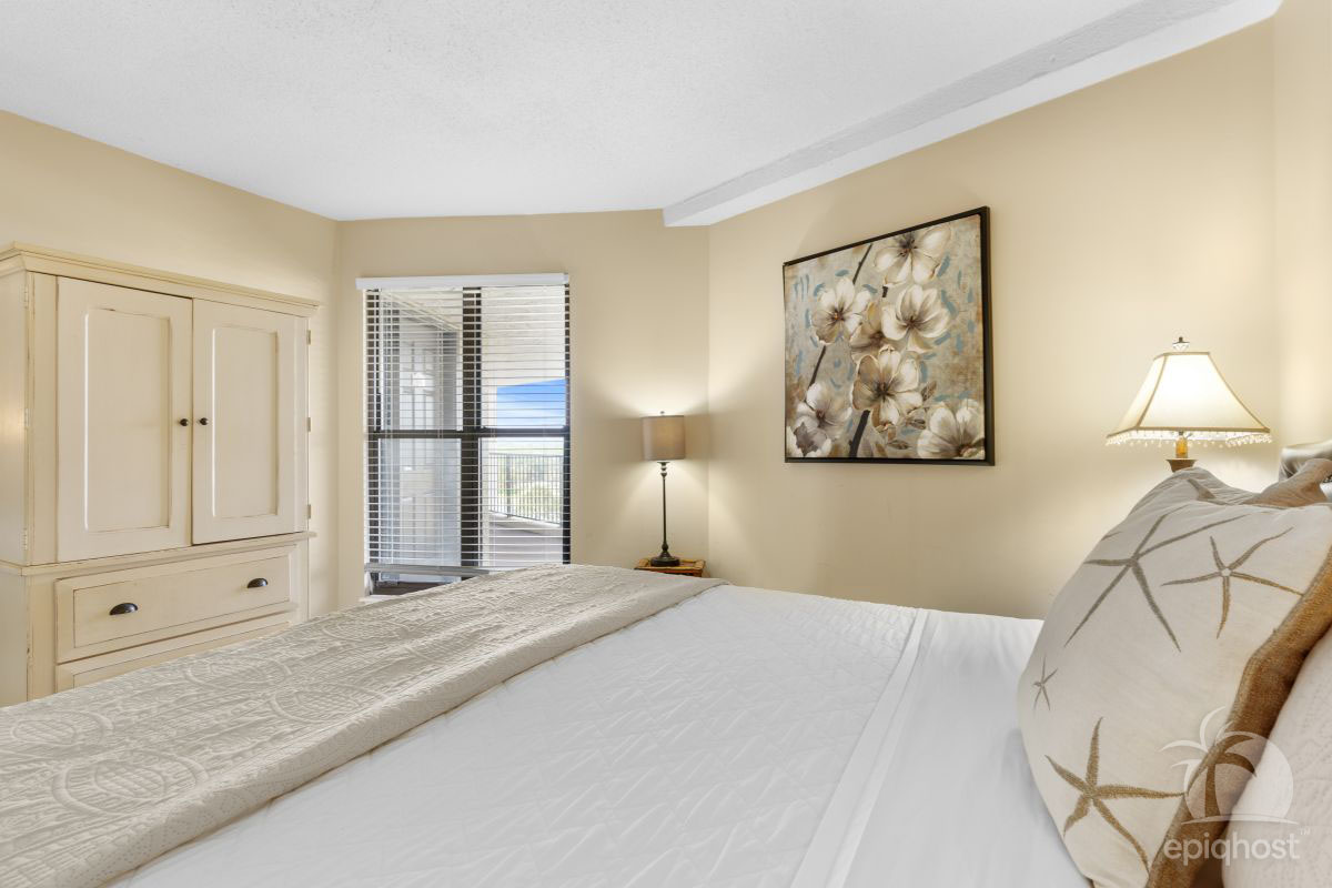 Guest bedroom with coastal décor and adjoining bath