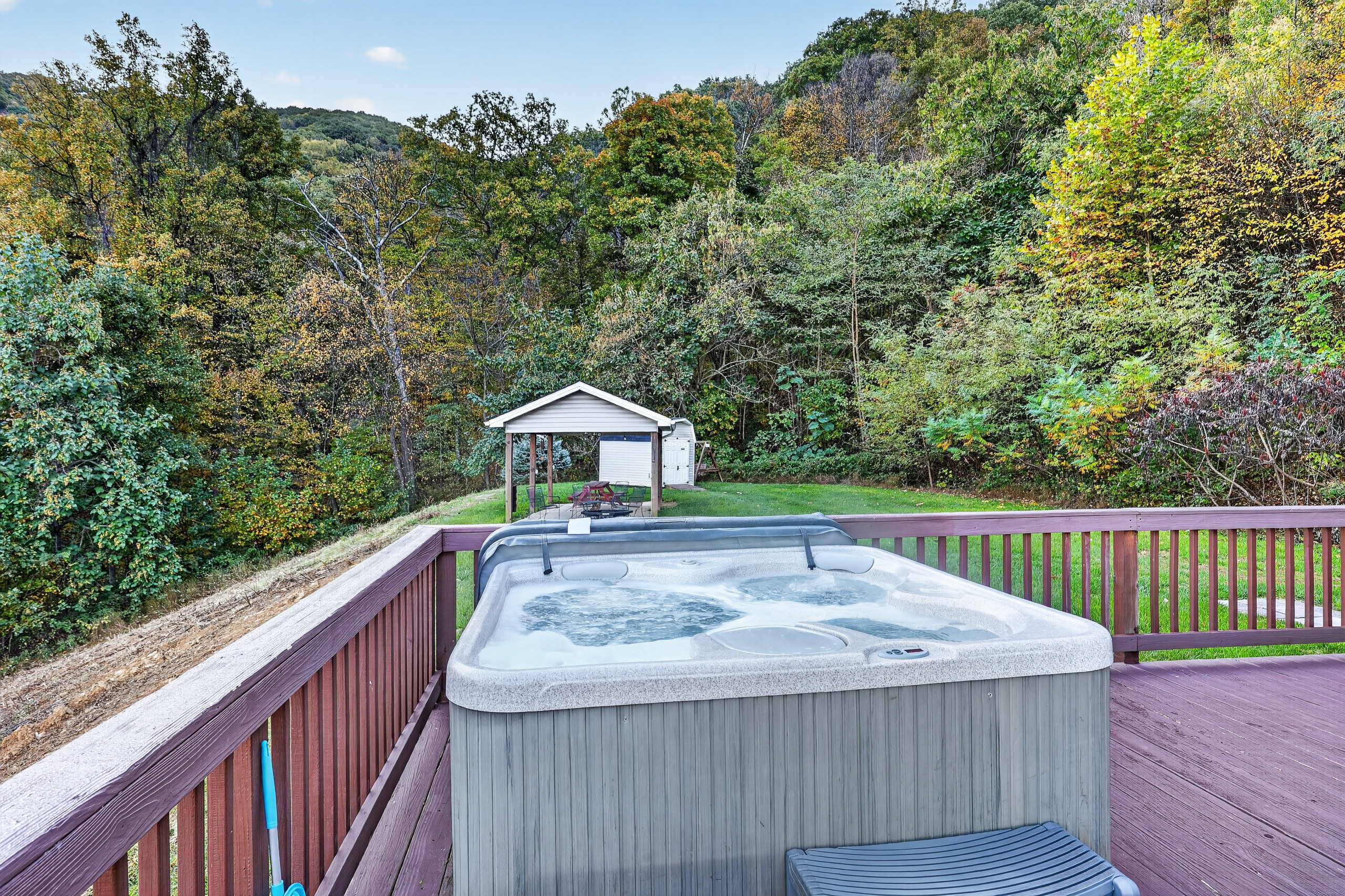 The hot tub enjoys views of the private back yard as well as the glorious valley, mountain, and park views.