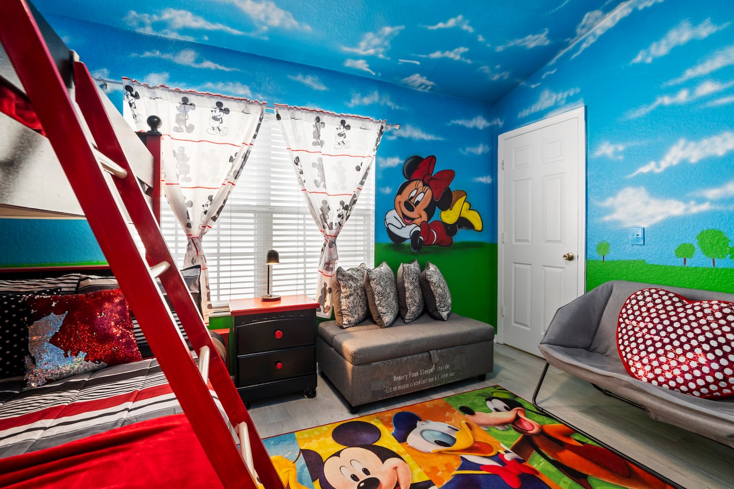 - Colorful Mickey and Minnie themed kids’ room with vibrant murals and bunk beds  
- Cozy sofa and playful decor create a magical and inviting atmosphere  
- Bright space for rest, play, and unforgettable Disney inspired memories  
