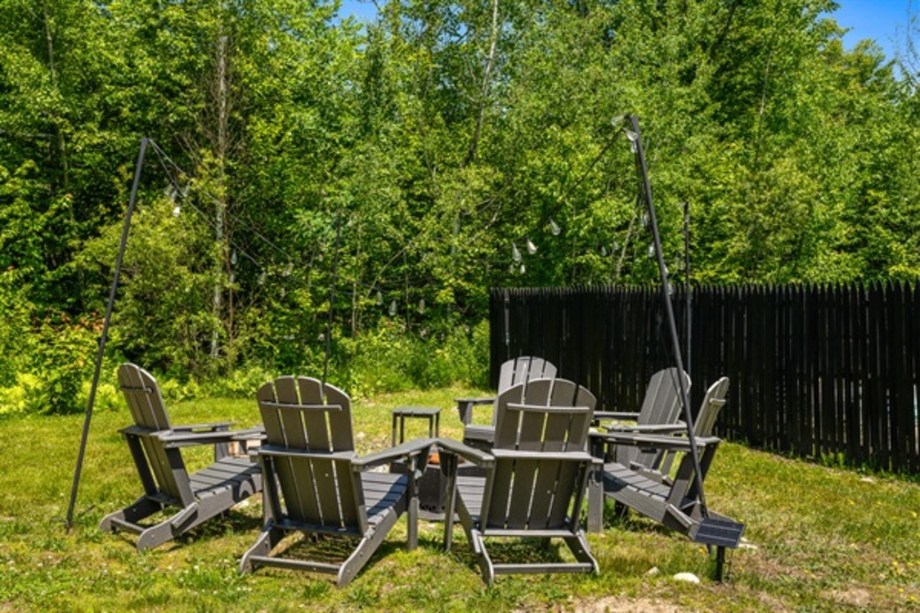 Gather under string lights for easy conversation, shared drinks, and evenings that naturally linger.