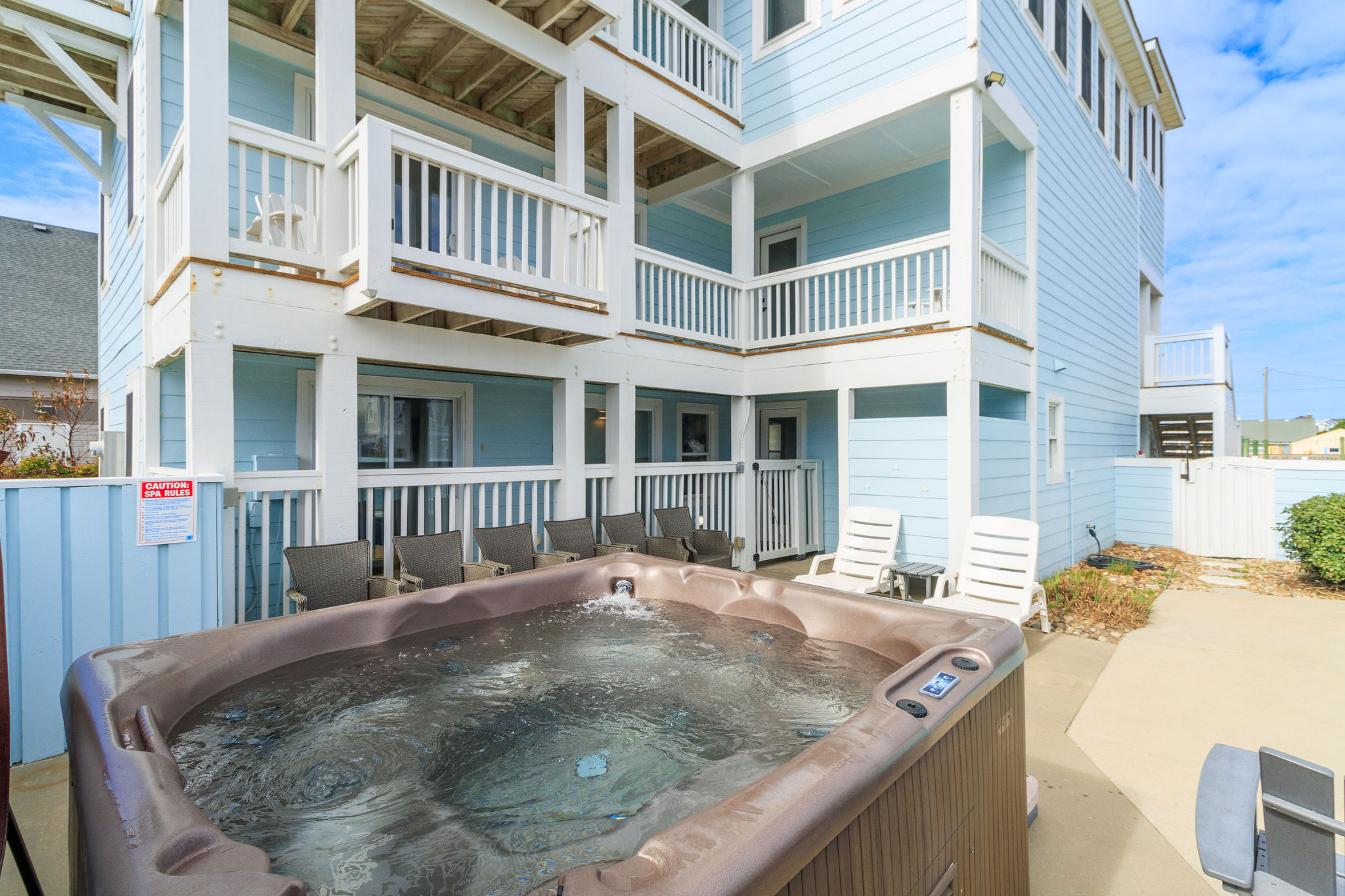 Relax in the hot tub or in one of the many chairs by the pool