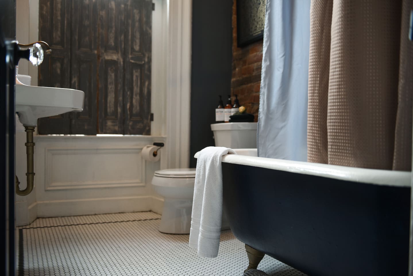 Stylish and unique bathroom featuring a relaxing bathtub — perfect for unwinding.