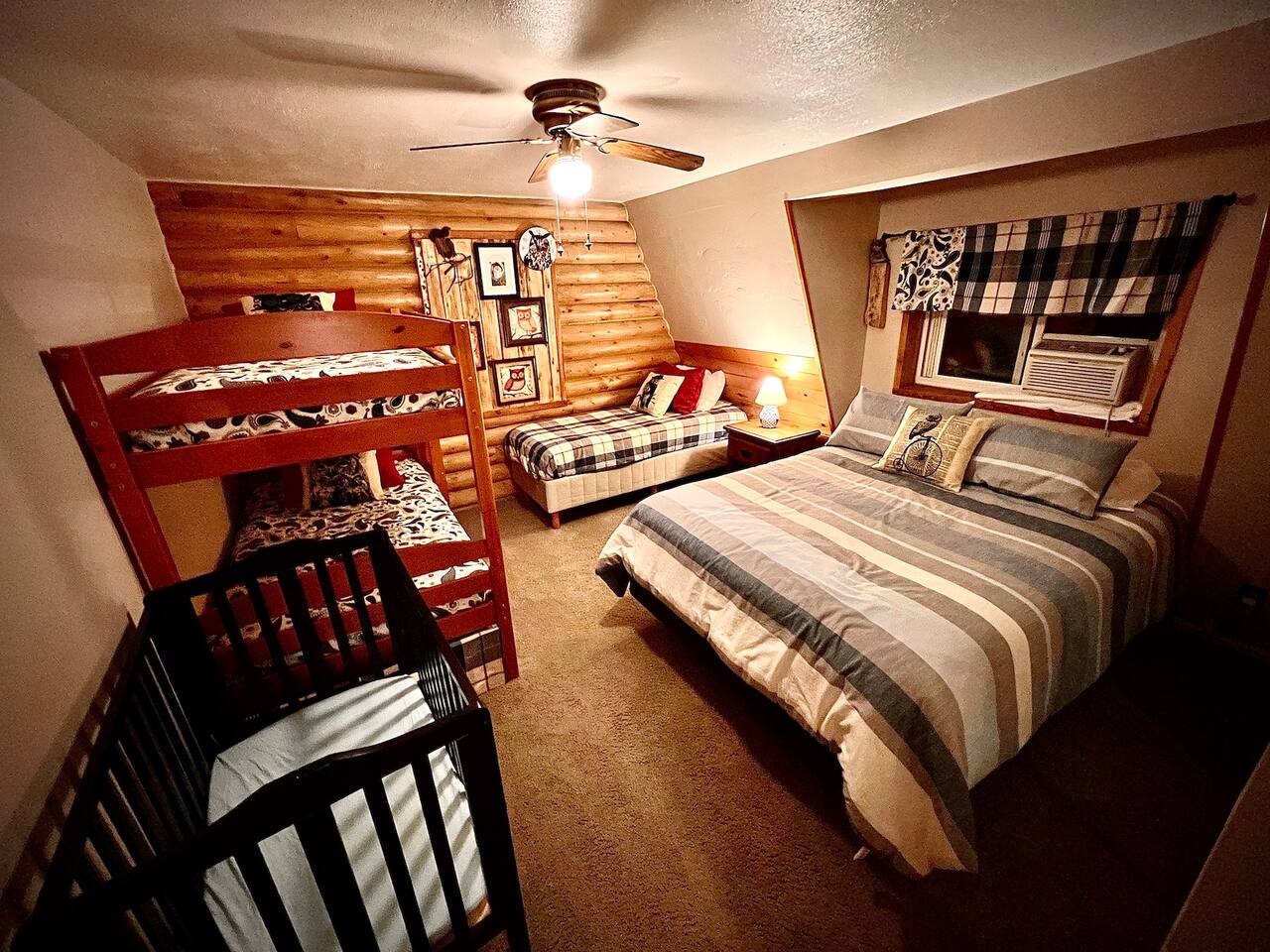 It's a Hoot, located on the 2nd floor, sleeps 5 with a queen bed, a bunk and a twin.  There is also another porta crib in this area.