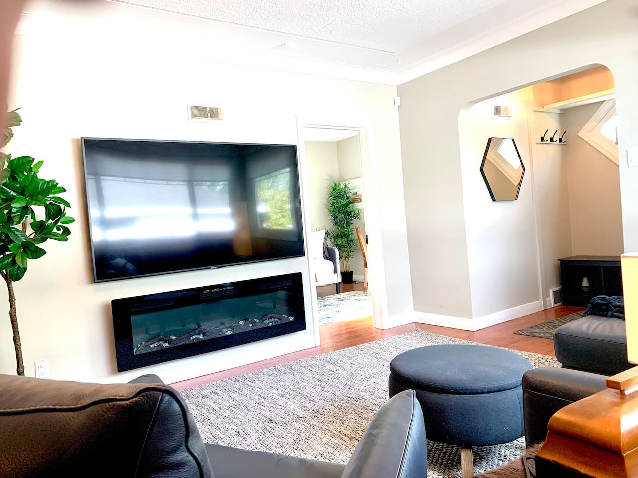 Bright Main Living Room with 75″ Smart TV & Cozy Fireplace