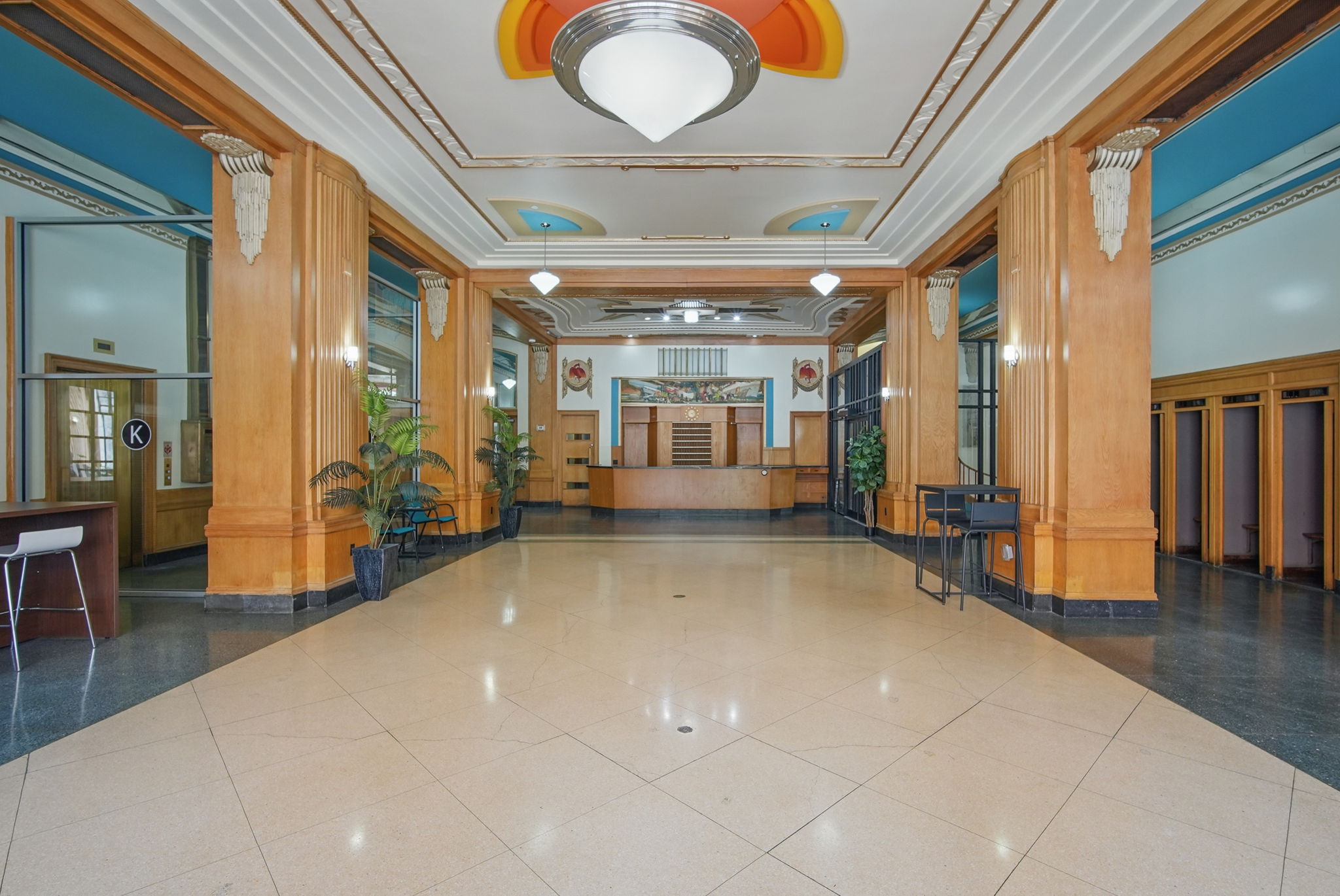The bright Art Deco lobby offers floor-to-ceiling windows, colorful ceiling designs, and gathering space. Sip coffee, meet friends, or just soak in the history and vibrant energy of this one-o