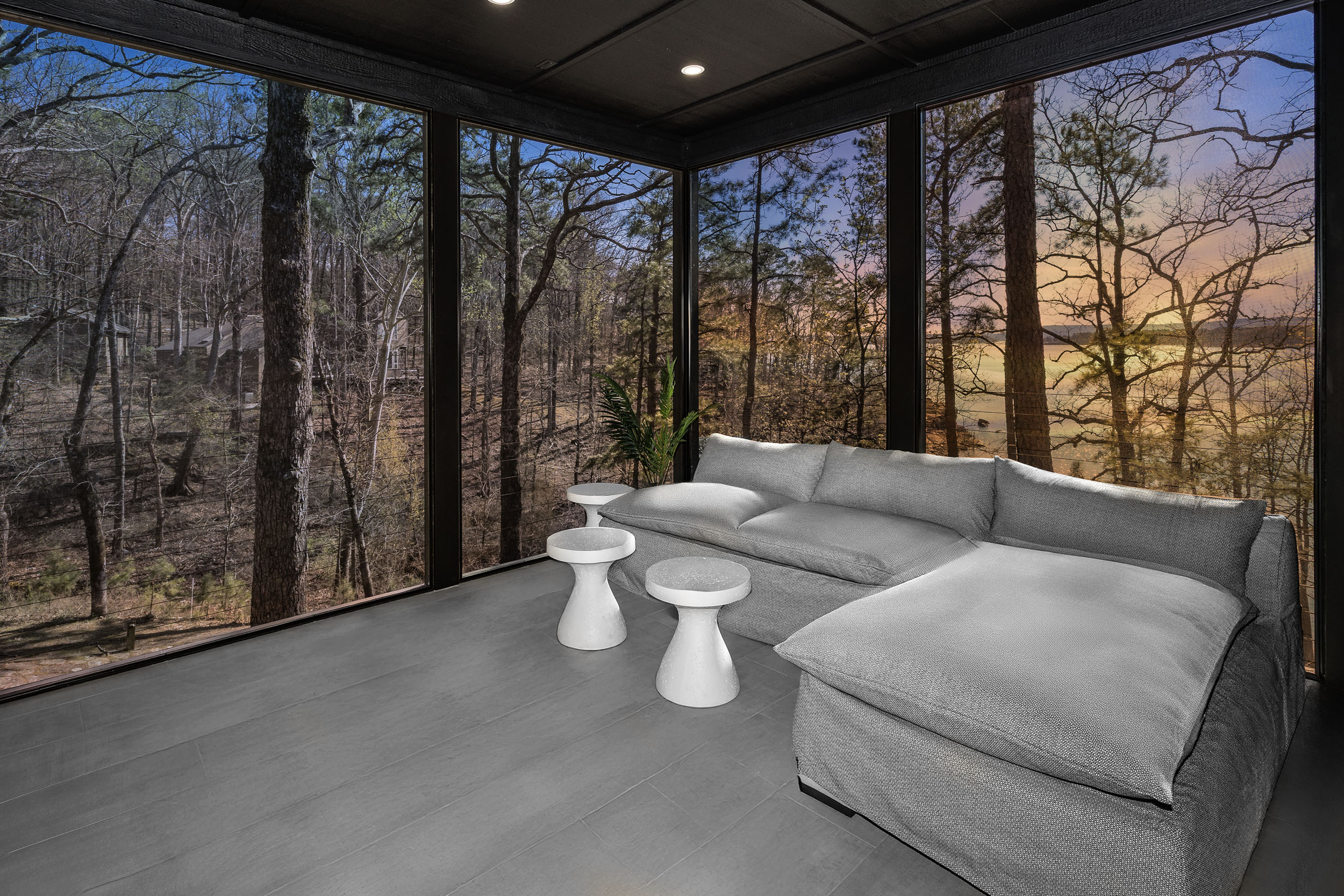 Soak in stunning lake views from the cozy screened-in porch, a peaceful retreat no matter the season.