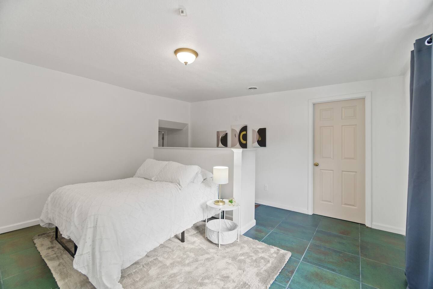 Cozy double bed with a soft carpet underneath, providing a comfortable and inviting space for a restful night's sleep.