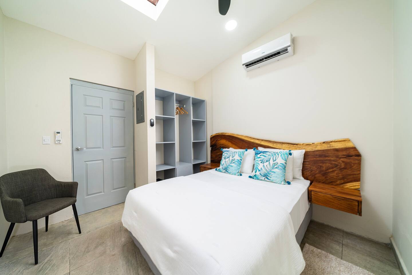 The guest bedroom has a queen bed and ample closet space, air conditioning & ceiling fan