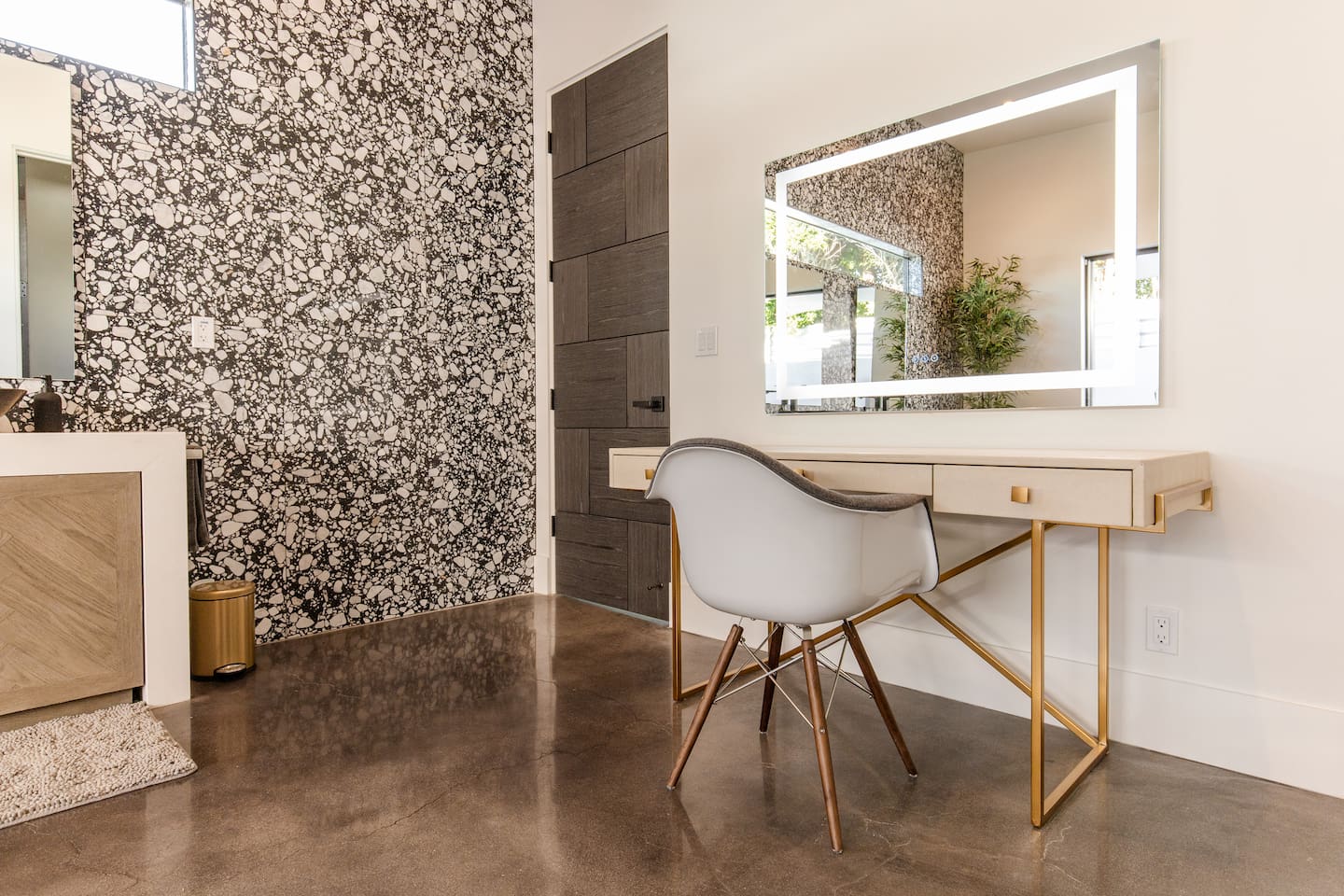 Makeup vanity with lighted mirror